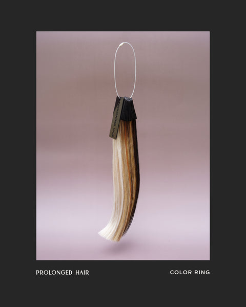 Prolonged hair with a color ring on a pink background