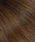 Close-up of natural brown raw hair extensions, smooth texture from Prolonged Hair